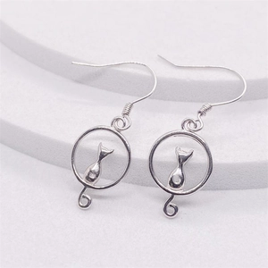 Elegant S925 sterling silver cat moon hoop earrings for women on a white textured surface