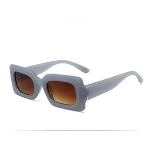 Close-up of translucent light blue jelly frames with gradient brown sunglass lenses
