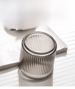 Detailed close-up of premium vertical ribbed texture on smoky grey glass storage container