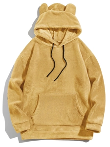Detailed view of yellow fleece hoodie with cute bear ears and kangaroo pocket