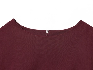 Detail of burgundy balloon mini dress showing crew neck and hidden back zipper
