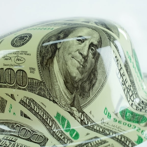 Macro detail of high-gloss dollar bill print on a durable round party top hat