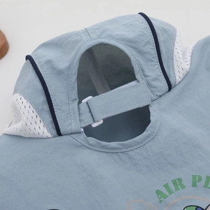 Close-up of adjustable strap and breathable mesh on children's sun hat back