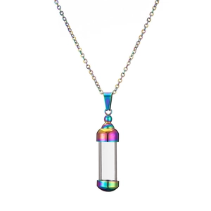 Macro view of a rainbow metal and glass openable perfume bottle pendant necklace