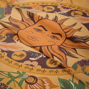 Velvet tarot tablecloth with sun god face and twelve zodiac symbols in warm yellow