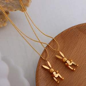Golden mechanical rabbit necklace with Luck engraving on minimalist ball chain