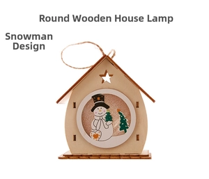 Detail of wooden Christmas house hanging ornament featuring a snowman and pine tree design