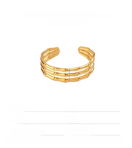 Detail showing golden bamboo texture stainless steel cuff bracelet and 16mm inner diameter