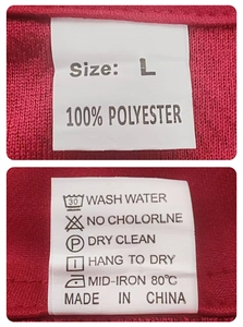 Gros plan détaillé de l'étiquette d'entretien et du tissu 100% polyester sur une chemise rouge