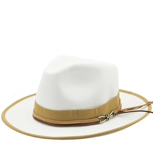 Macro detail of white wool fedora hat featuring yellow ribbon and brown leather cord