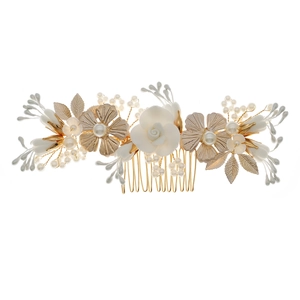 Golden bridal hair comb featuring delicate white flowers, pearls and leaves on white background