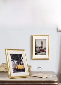 Detail of golden PVC photo frame showing desktop stand and wall mounting features