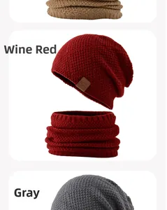 Detailed view of knitted winter hat and neck warmer set in burgundy, grey, and khaki colors