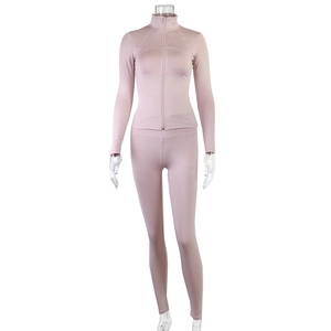 Close-up of pink zip-up stand collar sports jacket and high-waist leggings set