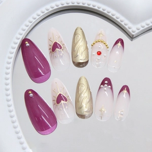 Deep purple almond press-on nails with golden heart patterns and pearl 3D details