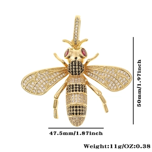 Detailed view of a gold bee pendant with gemstones and dimensions 50mm by 47.5mm