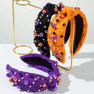 Detail of knotted headbands with colorful pearls and rhinestones for party accessories