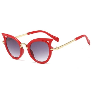 Fashionable cat eye sunglasses for kids with red frames and golden metal temples