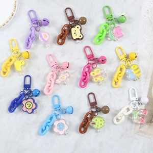 Detailed view of colorful cartoon animal keychains with thick chains and small bells