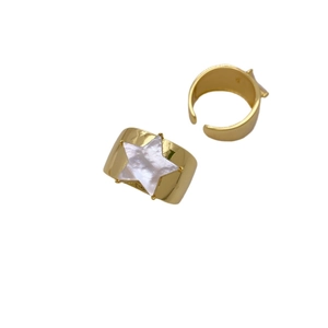 Gold-plated star-patterned shell ring set with white mother of pearl on white background