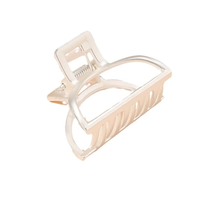 Champagne gold geometric hollow metal hair claw clip with spring detail on white background