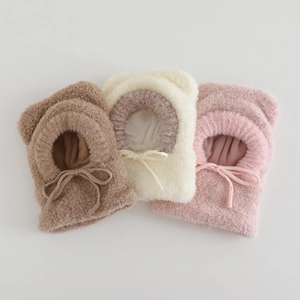 Detailed view of plush teddy fleece balaclava hats in brown, beige, and pink colors