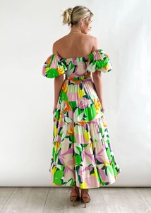 Detail of floral puff sleeves and layered ruffle hem on a summer bohemian maxi dress