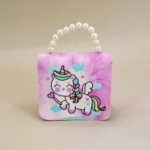 Detail view of pink tie-dye mini bag with cute cartoon unicorn and pearl top handle