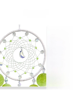 Detail of hand-woven dream catcher with snowflake crystals and purple moon pendant