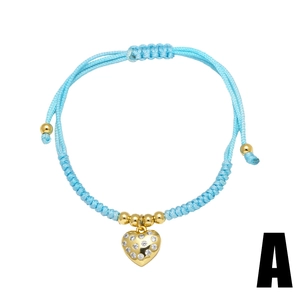 Sky blue braided rope bracelet featuring a gold heart pendant with white zircons