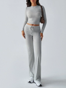 Full view of women's grey Y2K style long sleeve cropped top and drawstring pants set