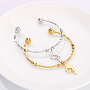 Minimalist gold and silver star charm open bangles set in polished stainless steel