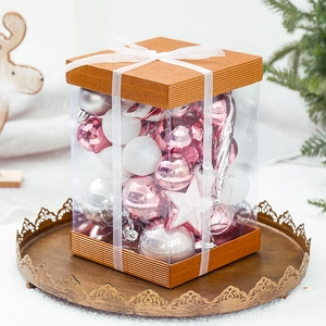 Shatterproof pink and white Christmas ornament set in transparent gift box with bow