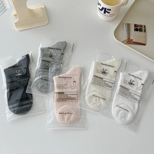 Five pairs of breathable cotton bow socks in black, grey, pink, beige, and white colors