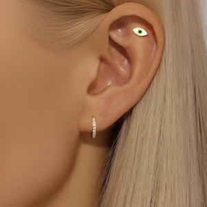 Minimalist S925 silver eye-shaped stud with green gem and gold hoop earring set on model