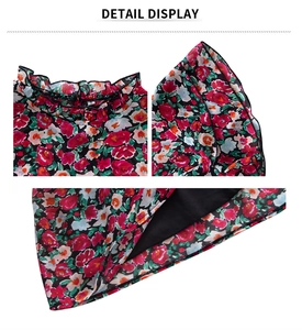 Detail display of floral print ruffles and high-quality stitching on black fabric