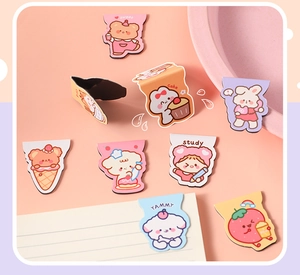Detailed view of nine cute cartoon animal and food shaped magnetic paper bookmarks