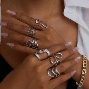 Minimalist silver wavy stackable rings set in stainless steel for women on hands