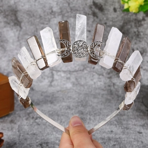 Detail of crystal crown with clear quartz and smoky quartz with triple moon goddess symbol