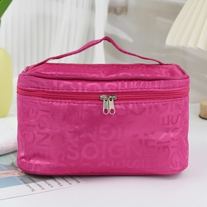 Rose red large capacity toiletry bag with embossed lettering and sturdy handle