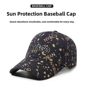 Detail view of black baseball cap with golden ink splatter and NY letters embroidery