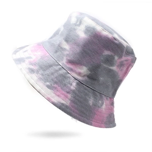 Detail of pink and gray tie-dye twill cotton bucket hat fabric texture on white background