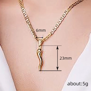 Golden chili pepper pendant necklace on model with 6mm width and 23mm height dimensions