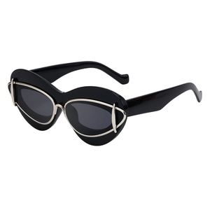 Fashionable oversized cat-eye sunglasses with black frame and silver metal accents