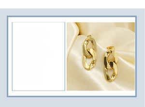 Close-up of 18K gold plated titanium steel chain earrings measuring 27x12mm in size