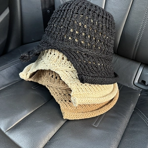 Stack of three breathable hollow-out knit sun hats in black, beige, and light brown colors