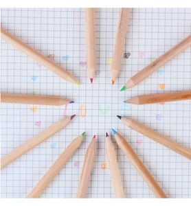 Radial layout of 12 natural wood colored pencils on grid paper with hand-drawn art