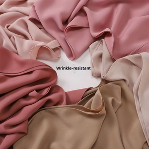 Wrinkle-resistant scarf fabric detail in elegant Morandi colors showing smooth texture