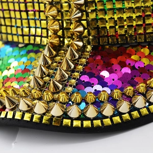 Macro shot of colorful sequins and gold metal studs on a rainbow stage captain hat