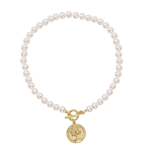 Elegant pearl necklace with gold portrait coin pendant and OT toggle clasp on white background